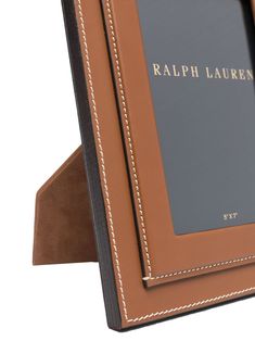 a brown and black photo frame with the word ralph lauren on it's side