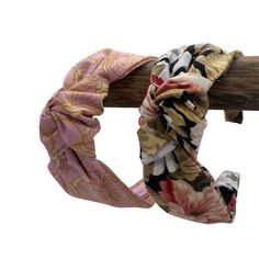 a close up of a headband on a wooden stick