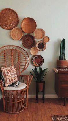 a room with wicker furniture and baskets on the wall