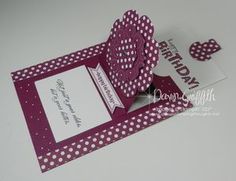 a purple and white birthday card with polka dots on the front, two hearts in the back