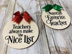 two wooden christmas ornaments hanging from strings on a white wood background with the words teachers always make the nice list and santa's favorite teacher