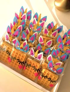 some waffles are decorated with pink and blue decorations