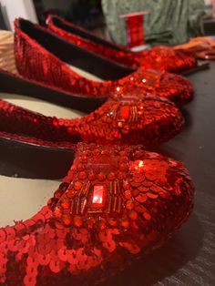 Handmade ruby slippers - just like Dorothy wears in The Wizard Of Oz. Very comfortable - great for costume parties, cosplay or theatrical productions.  Alternative colours and minor modifications available on request. Handmade by me in Melbourne, Australia. Each shoe takes about 3-4 hours to complete. (One pair 6-7 hours), excluding all the undercoating. I do my very best to get these shoes as close as possible to the original designs. I even use the original blueprints for the bows. Available s Ruby Slippers Wizard Of Oz, Wizard Of Oz Shoes, Grad Shoes, Silver Slippers, Shiny Shoes, Ruby Slippers, Costume Parties, The Wizard Of Oz, 7 Hours