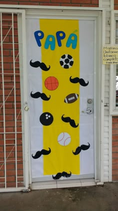 a door decorated with fake moustaches, balls and mustaches for a sport themed party