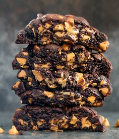 a stack of chocolate cookies with peanut butter on top