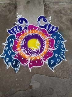 a colorful flower painted on the ground