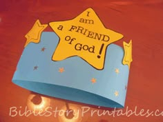 a paper hat with the words i am a friend of god written on it and stars