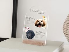 a clear acrylic plaque with pictures of dogs on it and the caption signature