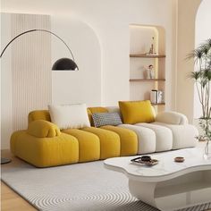 a living room with yellow and white furniture