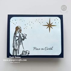 a handmade christmas card with a nativity scene and star on the top,