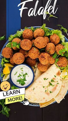 falafel on a plate with pita bread, lettuce and sauce