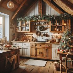 a rustic kitchen decorated for christmas with greenery