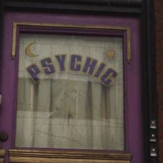 a purple door with the word psychic painted on it