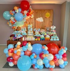 an assortment of balloons are on display at a birthday party