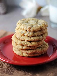 a stack of cookies sitting on top of a red plate