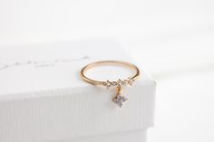 ❤ More styles at https://statementgrey.etsy.com This Forget-Me-Not Blossom Ring sparkles with stones in a dainty floral design, capturing shades of pink, blue, and purple in the light. A row of crystals adorns the band, and a delicate flower charm serves as a sweet reminder of true love, faithfulness, and remembrance. Keep your love close with this charming ring. MATERIALS: Cubic zirconia 14k Gold, Rose Gold, Rhodium Plated, Brass  Tarnish-resistant protective coating Friendship Ring, Cute Ring, Layered Rings, Clover Flower, Friendship Rings, Floral Ring, Sparkling Rings, Charm Rings, Gift Cute