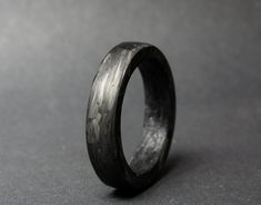 "This listing is for a handmade ring made with short carbon fibers in epoxy, giving the ring a unique look  Carbon fiber is a highly durable material! It's used in the aerospace industry and in race cars. -FREE SHIPPING WORLDWIDE- Every ring is handmade to order, no mass production. Each ring is made with a lot of care and time spent on every part of the process to make sure they all stand a very high standard. If you would like to customize the ring, feel free to use the \"request a custom order\" button on the shop, custom sizes, widths are available. Please note the turnaround time mentioned in the banner on top of the home page, if you need an order in a rush please contact me, it's usually available. Custom orders - build your ring I love custom orders; If you want a specific type of Carbon Fiber Ring, Forged Carbon Fiber, Carbon Fiber Rings, Antler Ring, Wood Stone, Mass Production, Handmade Ring, Custom Orders, Race Cars