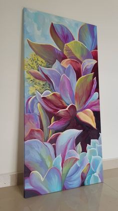 a painting of purple and blue flowers on a white wall