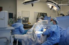 medical personnel performing surgery in an operating room