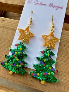 christmas tree earrings with gold stars on them