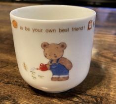 there is a coffee cup with a bear on it