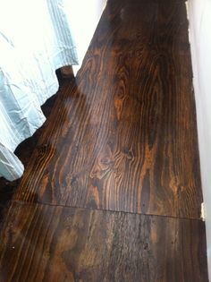 a wooden floor that has been stained brown