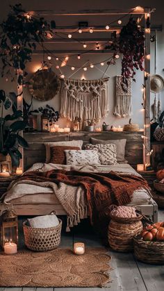 a bedroom with lots of lights and blankets on the bed, surrounded by wicker baskets