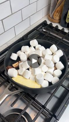 marshmallows are being cooked in a skillet on the stove with cheese