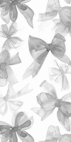 black and white photograph of large bows on a sheet of sheer organe fabric, as well as an additional bow for the headband