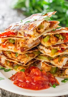 stack of quesadillas with salsa on the side