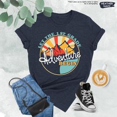 there is a t - shirt that says, let the 1st grade adventure begin on it