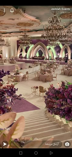 an image of a fancy event setting with flowers and chandeliers