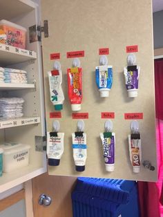 a medicine cabinet filled with lots of different types of toothpaste