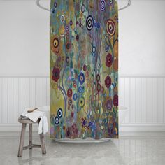 the shower curtain is decorated with an image of sunflowers and other colorful flowers