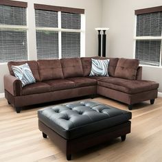 a living room filled with furniture and windows