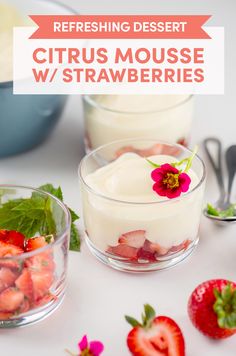 two desserts with strawberries and cream in them