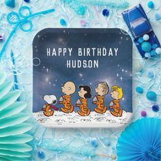 a happy birthday card with the characters from peanuts and charlie brown on it, surrounded by blue decorations