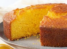 a close up of a cake on a plate with a slice cut out of it