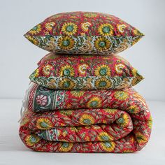 three pillows stacked on top of each other