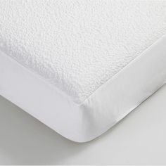 a close up view of a white mattress with no sheets or covers on the bottom