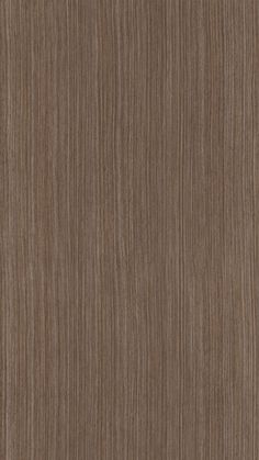 a close up view of the wood grain pattern on a surface that is very dark brown