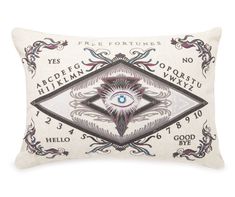 a decorative pillow with an eye on the front and words in black, white and blue