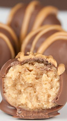 chocolate covered candy with peanut butter on top