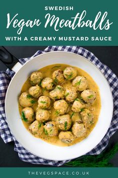 a white bowl filled with meatballs covered in gravy