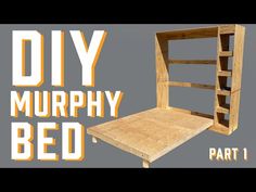 a bed made out of wood with the words diy murphy bed part 1 on it