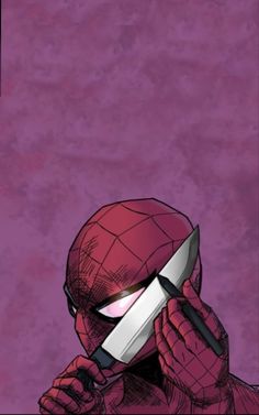 the spider - man is holding a knife up to his face