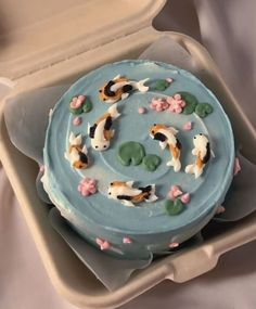 there is a cake decorated with koi fish on it