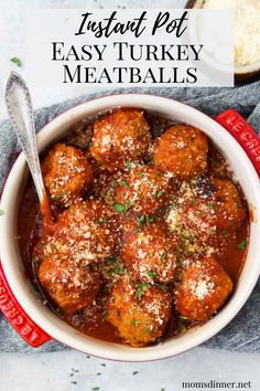 a white bowl filled with meatballs covered in marinara sauce and parmesan cheese