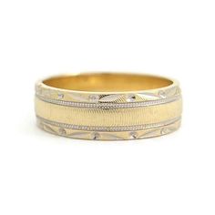 Vintage 1940's Two-Tone Etched Floral Wedding Band Ring 14K Yellow Gold, 5.57 Gr This is a beautiful ring that could be worn as a wedding band or statement ring. Please let us know if you have any questions. Circa: 1940's Metal: 14K yellow and white gold Weight: 5.57 grams Stamped: 14K Size: 8.5 (can be slightly stretched for a small fee) Width: 6 mm Heirloom Yellow Gold Bands With Decorative Details, Heirloom Ring With Thick Decorative Band, Heirloom Wide Band Yellow Gold Ring, Gold Milgrain Round Band, Heirloom 14k Gold Open Band, Heirloom 14k Gold Wedding Band Thick Shape, Heirloom Ring With Decorative Wide Band, Gold Milgrain Bands For Anniversary, Heirloom Rings With Decorative Wide Band