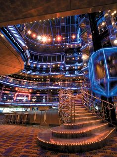 the inside of a building with stairs and lights